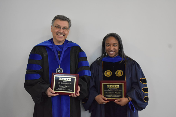 Drs. Quarto and Wilson holding awards.