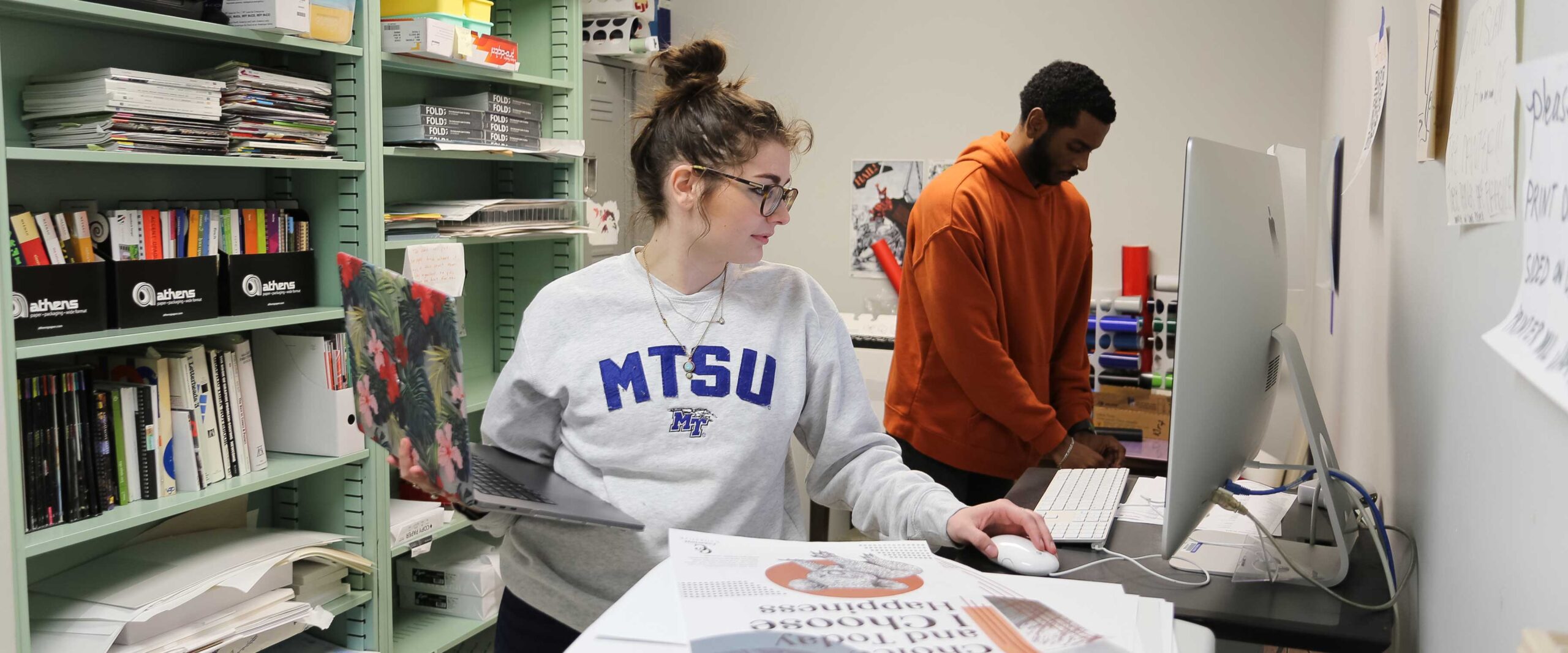 MTSU Student works on graphic design project on the computer.