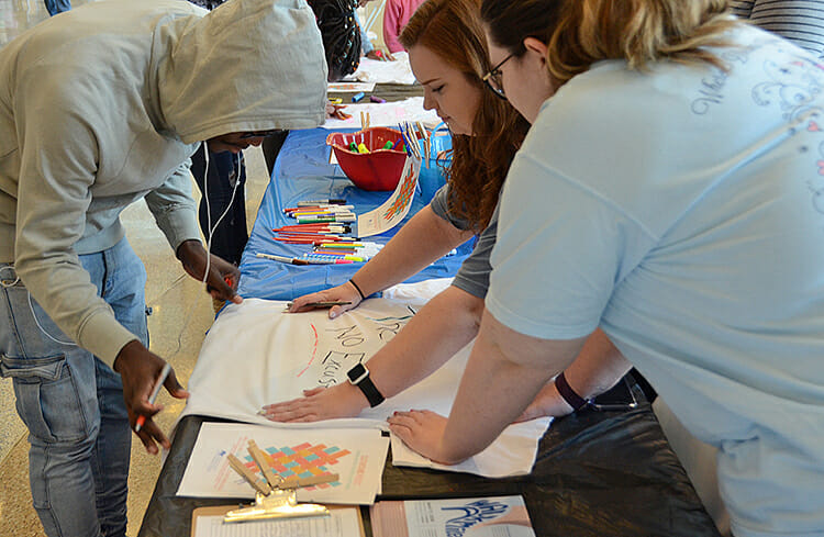 MTSU students stop by the Student Union atrium April 9 to write messages on T-shirts as part of the university’s participation in The Clothesline Project, an annual nationwide project to combat sexual assault. MTSU students can stop by the atrium from 11 a.m. to 2 p.m. through April 12. (MTSU photo by Jimmy Hart)