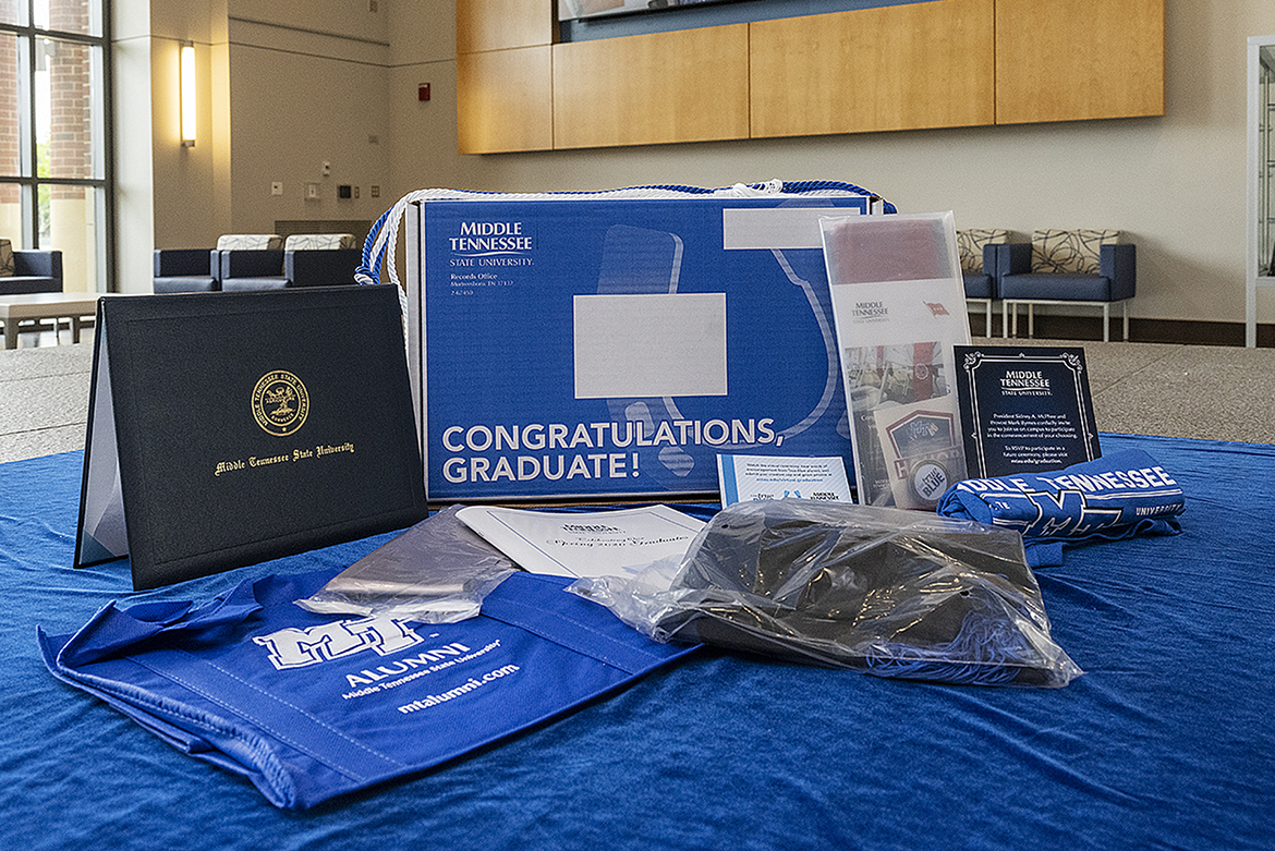 This display in the lobby of MTSU’s Student Services and Admissions Center shows the contents of the “True Blue Graduation Box,” which includes a diploma cover, special tassel and other gifts. MTSU is providing the boxes for all summer Class of 2020 graduates. The university conducted a virtual commencement ceremony Saturday, Aug. 8 after canceling its traditional ceremonies at Murphy Center for a second time because of the COVID-19 pandemic. (MTSU file photo by Andy Heidt)