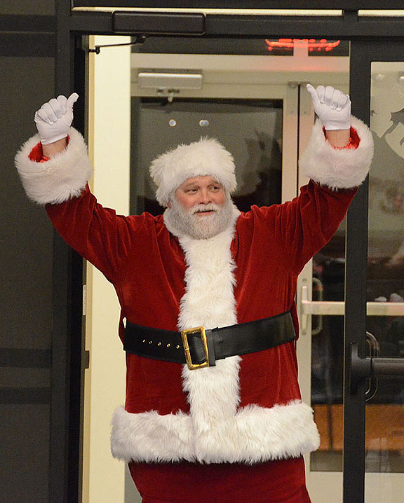 Santa Claus (aka Rich Kershaw, director of MTSU Student Programming) makes his entrance at this year’s annual Little Raiders Christmas Party. (MTSU photo by Jimmy Hart)