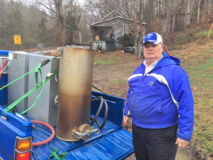 Recently retired professor and alternative fuels researcher Cliff Ricketts takes a break from his recent research drive using a combination of a wood gasification unit and gasoline. (Submitted photo)
