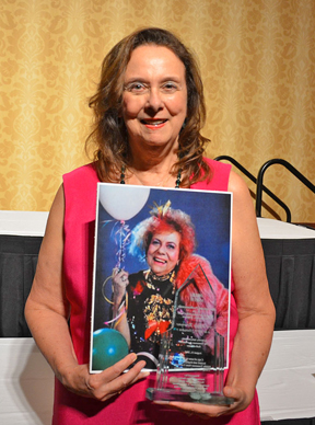Drucilla Smith Fuller holds a photo of her late mother, trailblazing journalist Drue Smith, and the posthumous award Smith received for her induction into the 2015 class of the Tennessee Journalism Hall of Fame. The induction ceremony was held Aug. 11, 2015, at Embassy Suites in Murfreesboro, Tenn. (MTSU photo by Jimmy Hart)