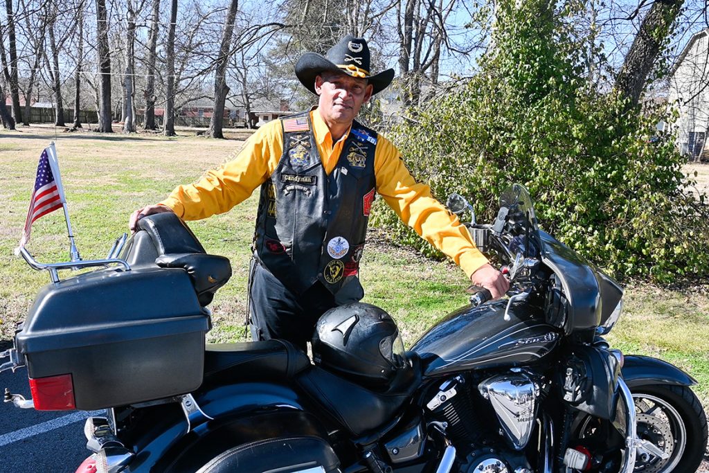 Leroy Carter, Middle Tennessee State University police officer, stands in his Buffalo Soldiers and Troopers Motorcycle Club uniform with his 2012 Yamaha V Star 1300 Tourer bike on campus on Feb. 5, 2021. (MTSU photo by Stephanie Barrette)