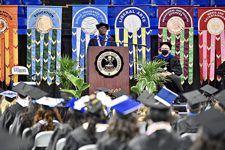 MTSU President Sidney A. McPhee speaks to the Class of 2021 from the stage inside Murphy Center Friday, May 7, at the first of the university's spring 2021 commencement ceremonies as Provost Mark Byrnes listens at right. Students returned to Murphy Center May 7-9 for the first time since 2019 for a three-day, 10-event, socially distanced commencement weekend. (MTSU photo by J. Intintoli)