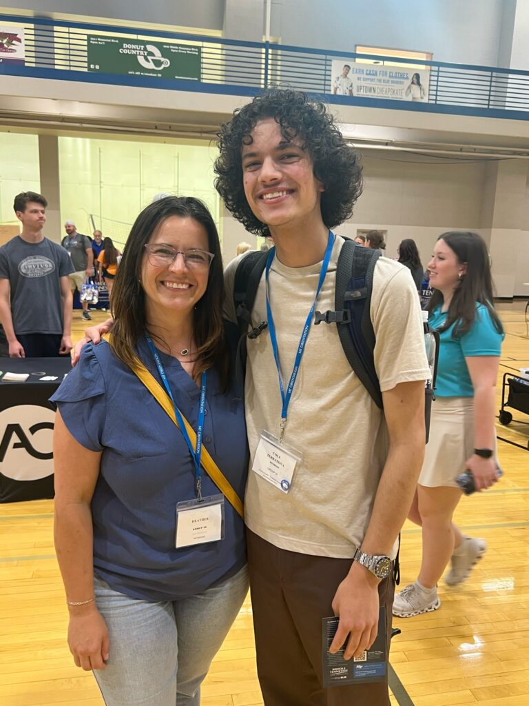 student and parent posing for a photo