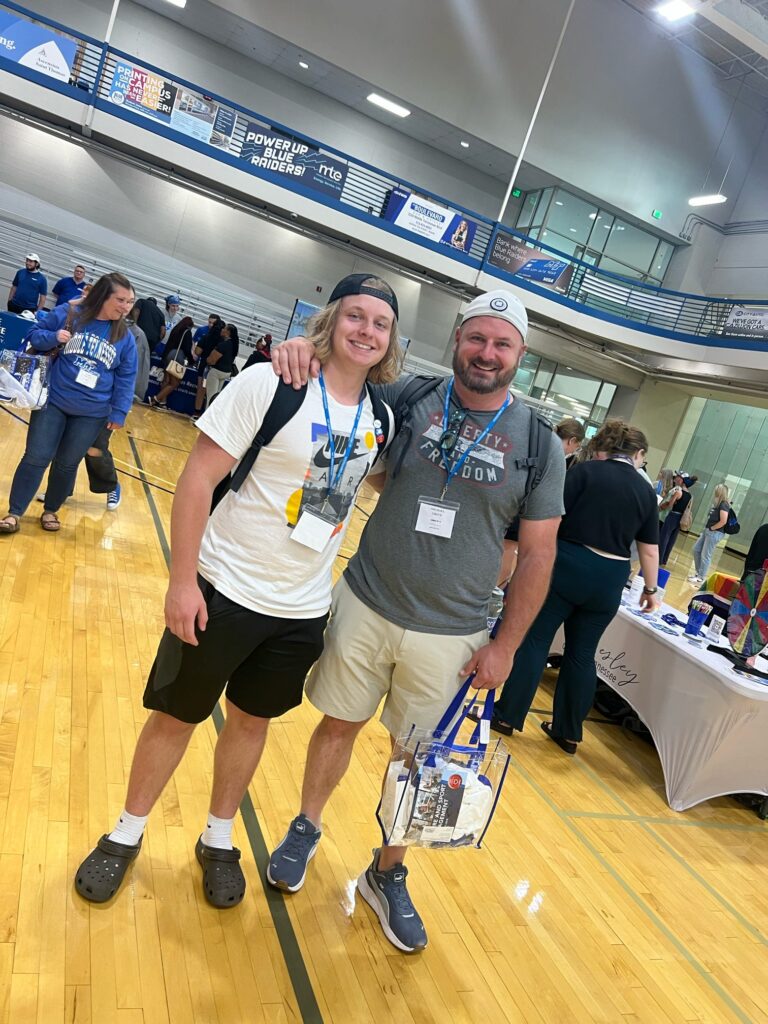 student and parent posing for a photo