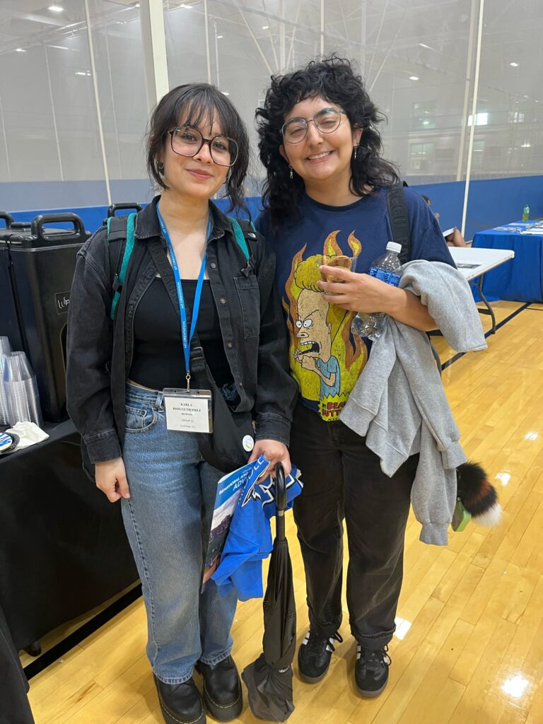 students posing for a photo at a tabling event