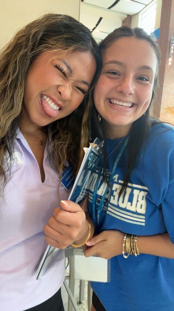 Student taking a selfie with their Student Orientation Assistant in the Student Union Building.