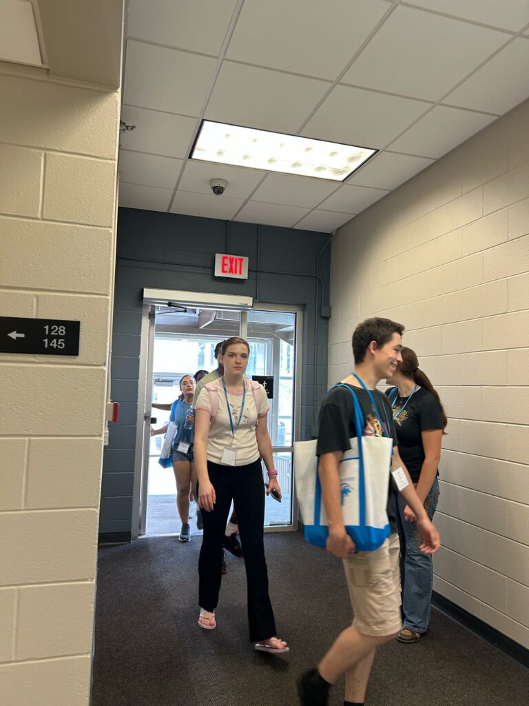 Students walking to an orientation session.