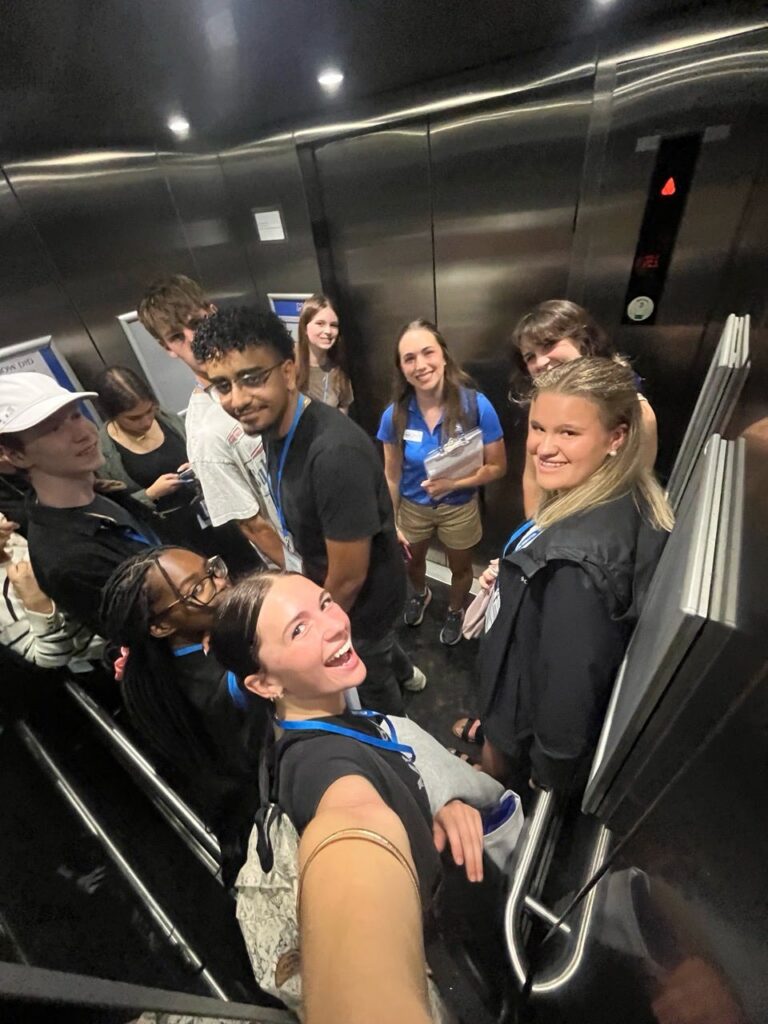 Students attending New to Blue Orientation posing for a photo with their Student Orientation Assistant.