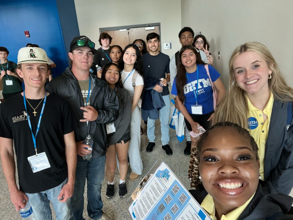Students attending New to Blue Orientation posing for a photo with their Student Orientation Assistants.
