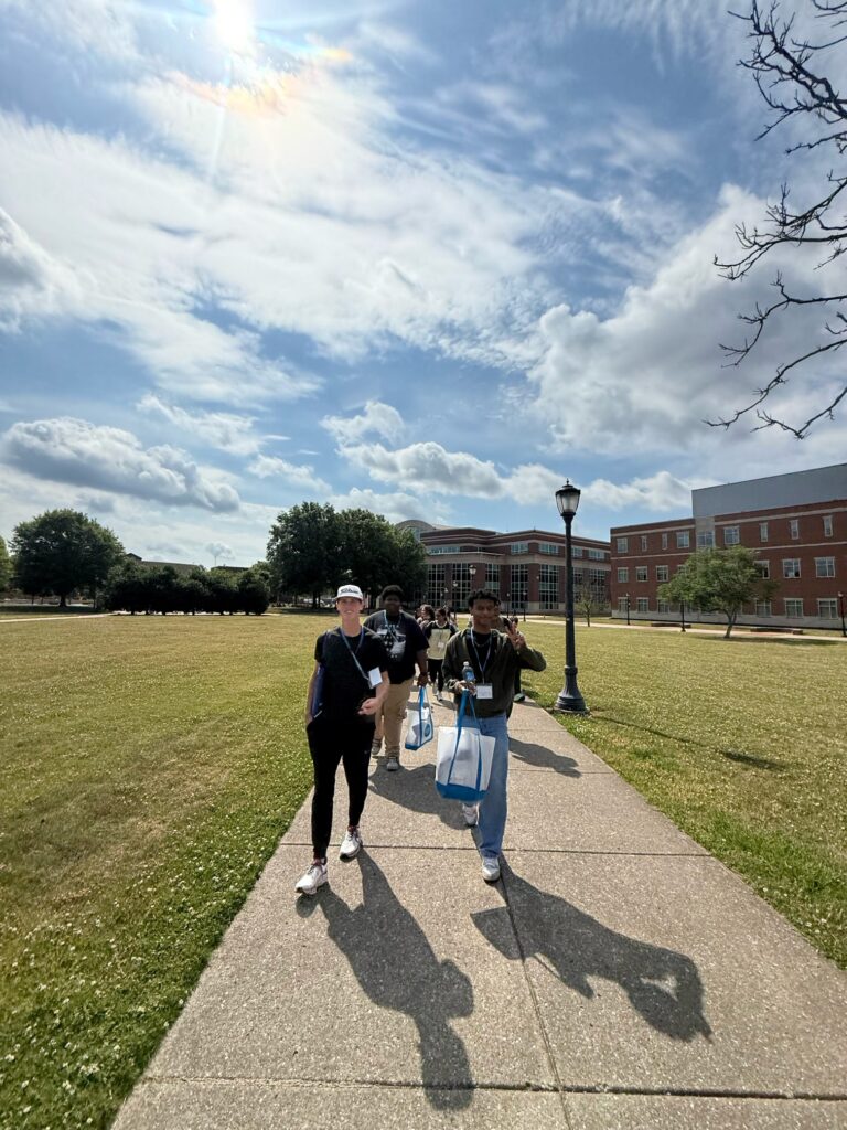 Students attending New to Blue Orientation walking through campus.