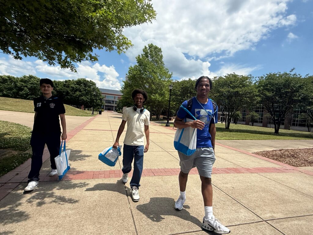 Students attending New to Blue Orientation walking across campus.