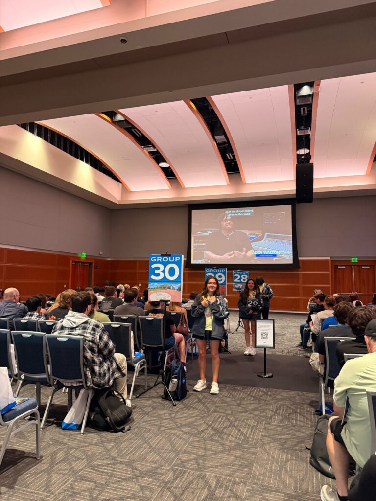 The Student Union Ballroom with Student Orientation Assistants interacting with their students and guests.