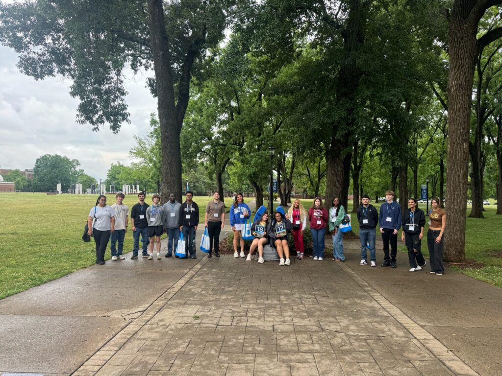 Students in Group 17 and 18 of orientation posing for a photo at the blue horseshoe at MTSU with their Student Orientation Assistants.