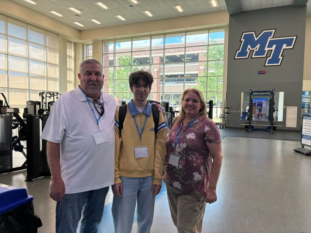 Student and guests attending New to Blue Orientation posing for a photo in the Recreation Center.