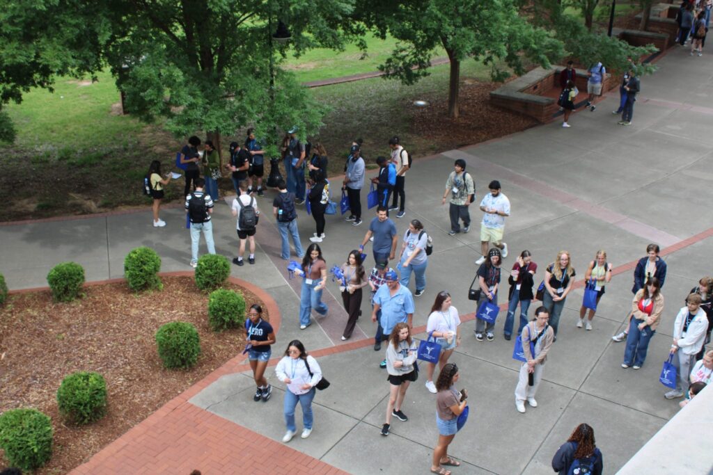 An ariel photo of student attending orientation with their Student Orientation Assistant.