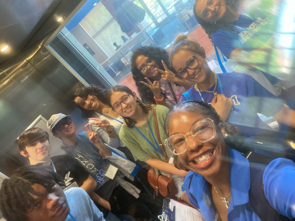 Students attending New to Blue Orientation posing for a photo with their Student Orientation Assistant.