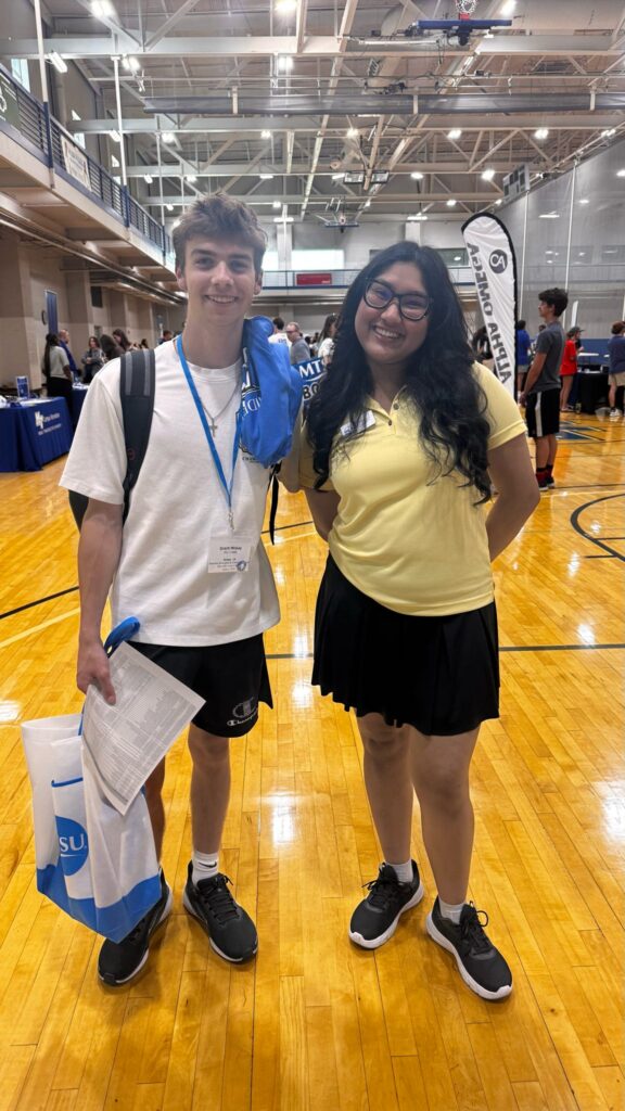 Student attending New to Blue Orientation posing for a photo with their Student Orientation Assistant.