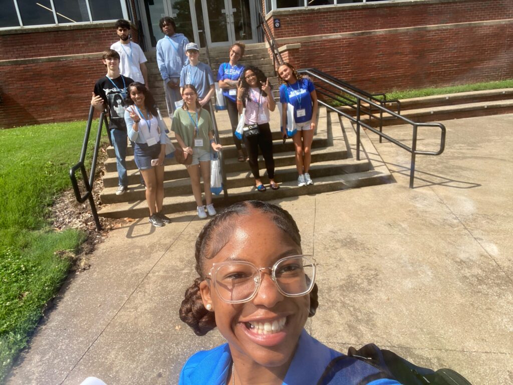 Students attending New to Blue Orientation posing for a photo with their Student Orientation Assistant.