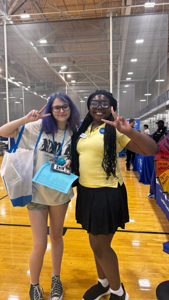 Student attending New to Blue Orientation posing for a photo with their Student Orientation Assistant.