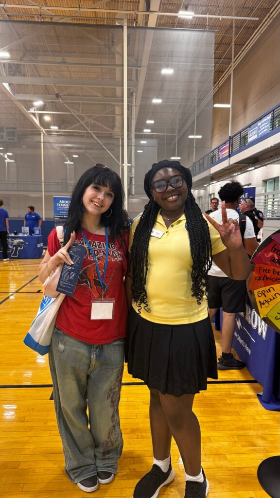 Student attending New to Blue Orientation posing for a photo with their Student Orientation Assistant.