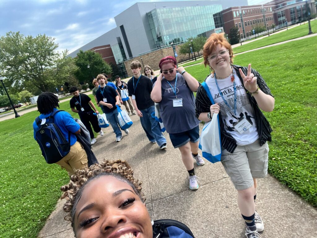 Students attending New to Blue Orientation posing for a photo with their Student Orientation Assistant.