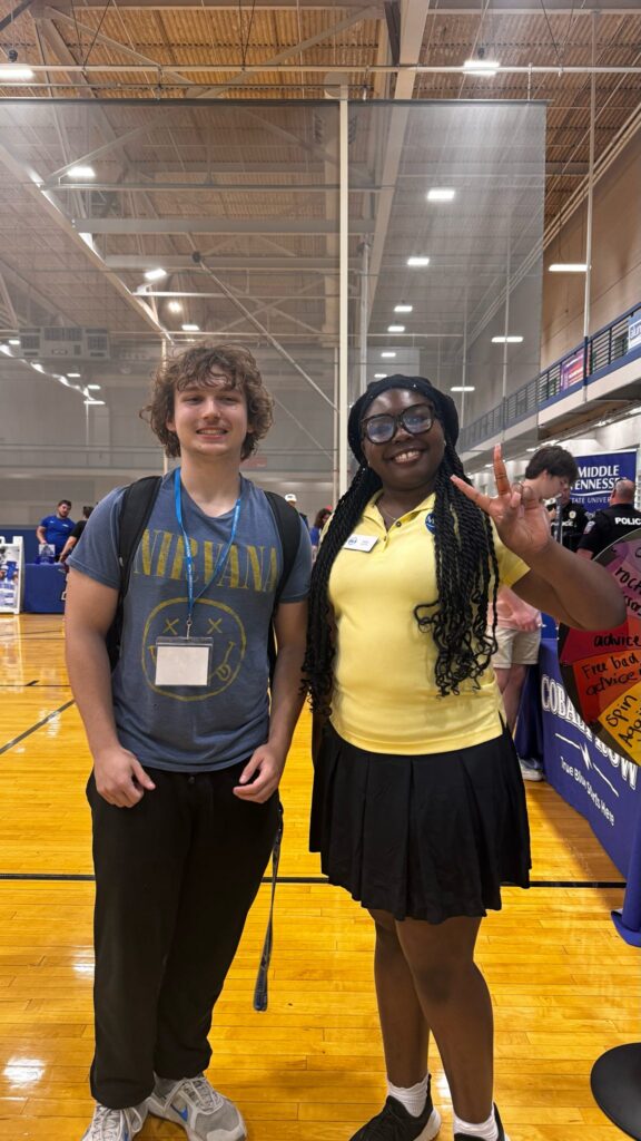 Student attending New to Blue Orientation posing for a photo with their Student Orientation Assistant.