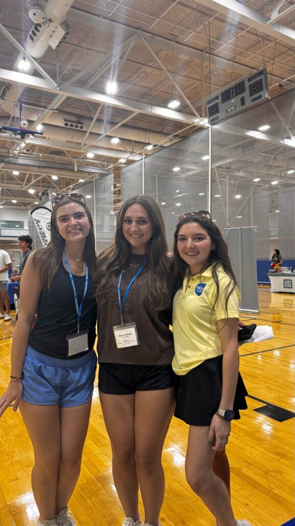 Students attending New to Blue Orientation posing for a photo with their Student Orientation Assistant.