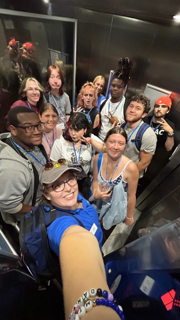 Students attending New to Blue Orientation posing for a photo with their Student Orientation Assistant.