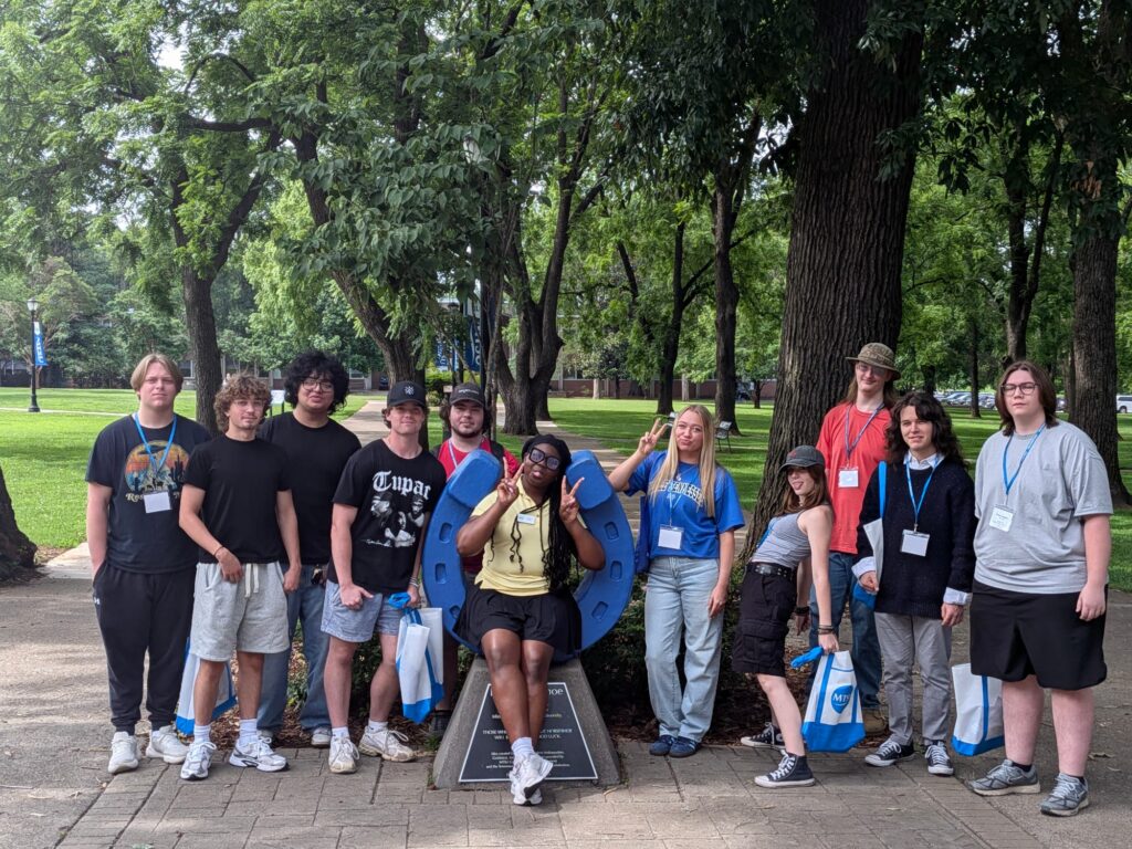 Students attending New to Blue Orientation posing for a photo with their Student Orientation Assistant.