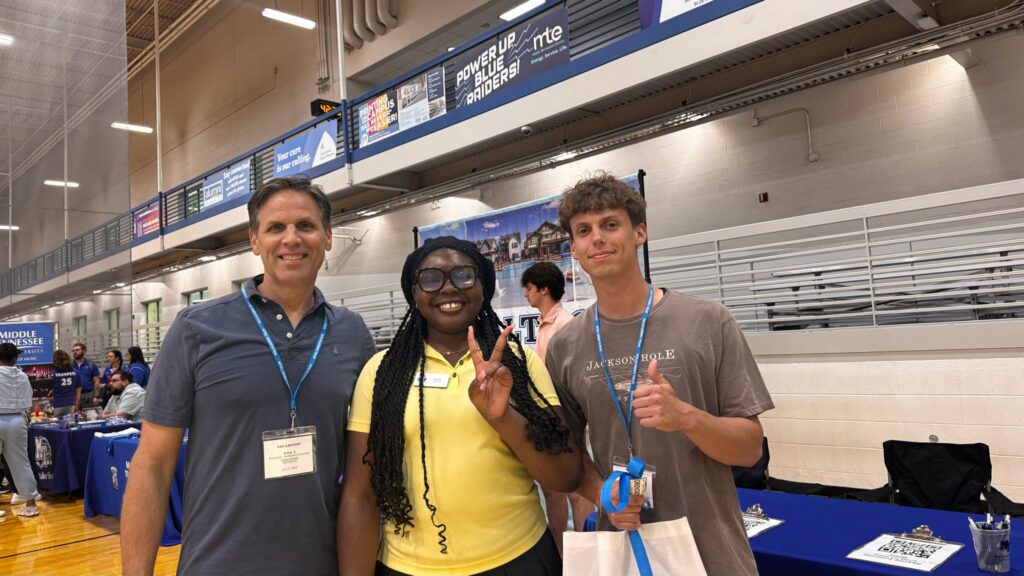 Students attending New to Blue Orientation posing for a photo with their Student Orientation Assistant.