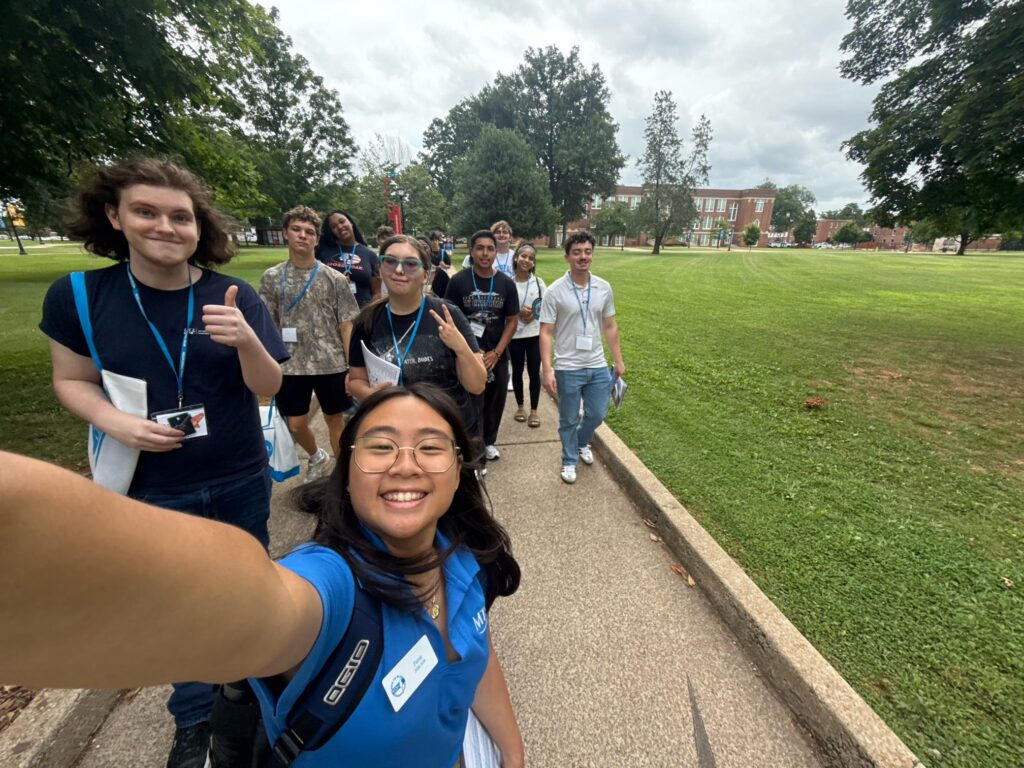 Students attending New to Blue Orientation posing for a photo with their Student Orientation Assistant.
