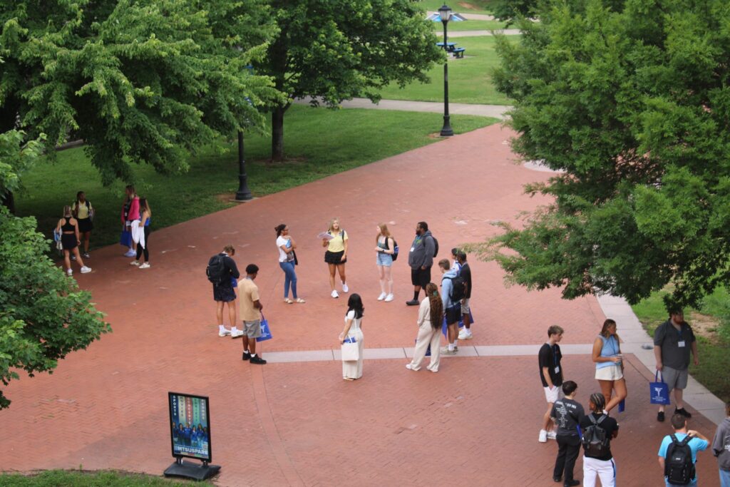 An ariel photo of student attending orientation with their Student Orientation Assistant.