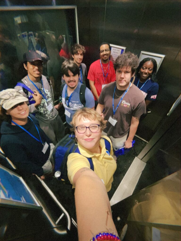 Students attending New to Blue Orientation posing for a photo with their Student Orientation Assistant.