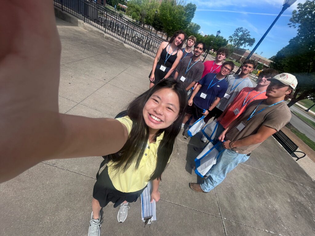 Students attending New to Blue Orientation posing for a photo with their Student Orientation Assistant.