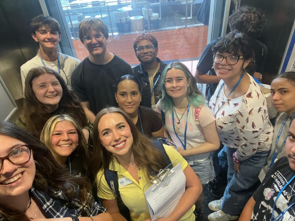 Students attending New to Blue Orientation posing for a photo with their Student Orientation Assistant.