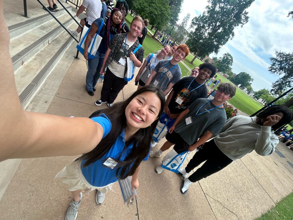 Students attending New to Blue Orientation posing for a photo with their Student Orientation Assistants.