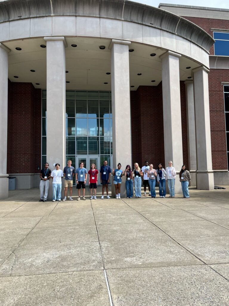 Students attending orientation standing outside the Business and Aerospace Building.