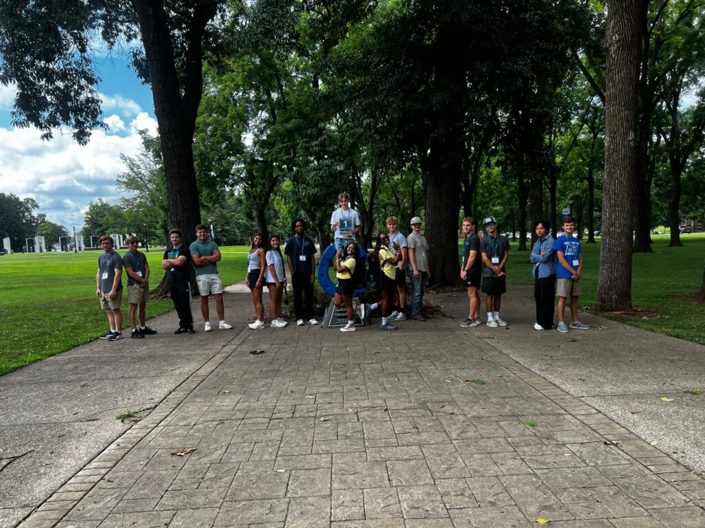 Students in Group 1 of orientation posing for a photo at the blue horseshoe at MTSU with their Student Orientation Assistants.