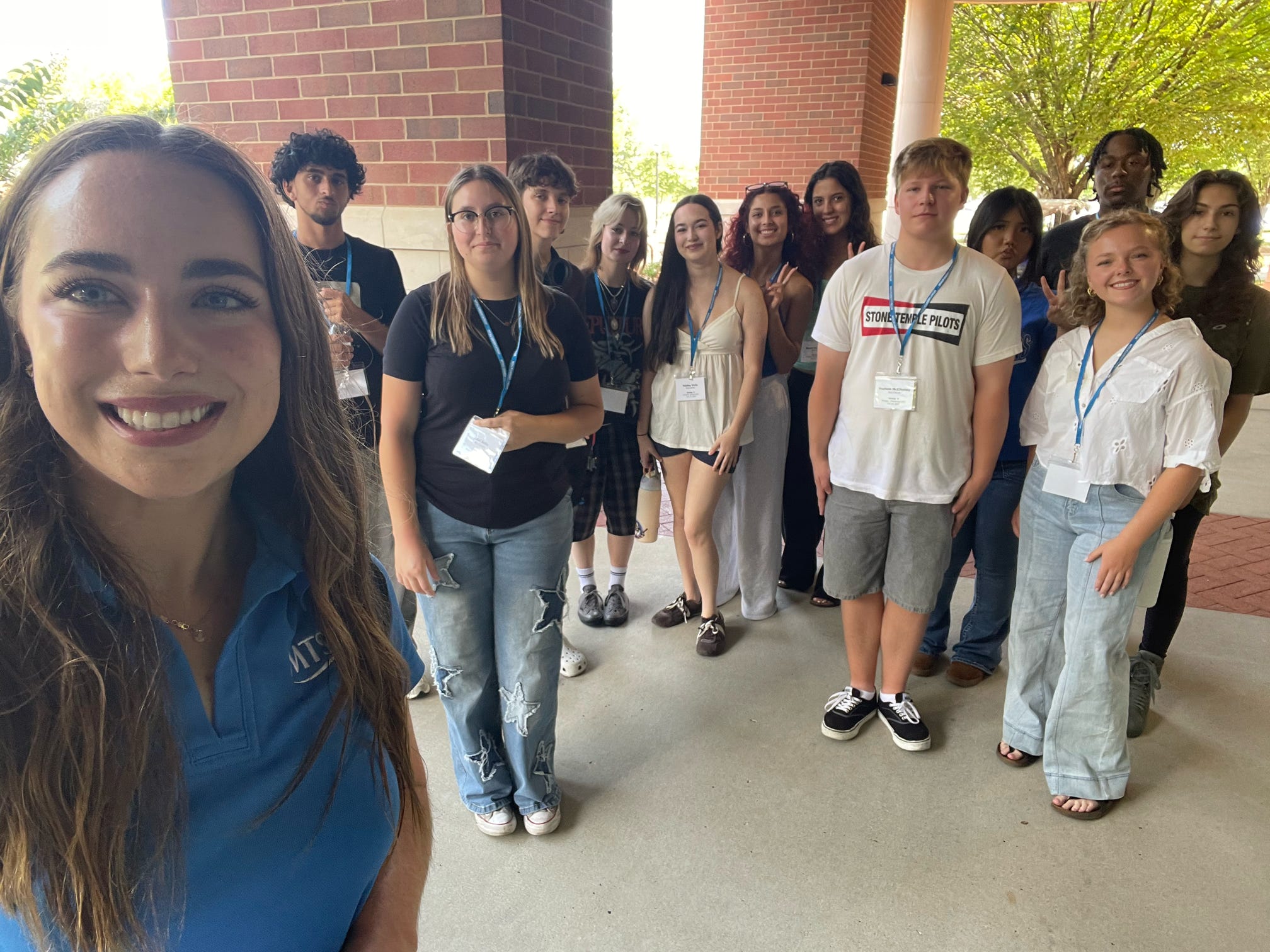Students attending New to Blue Orientation posing for a photo with their Student Orientation Assistant.