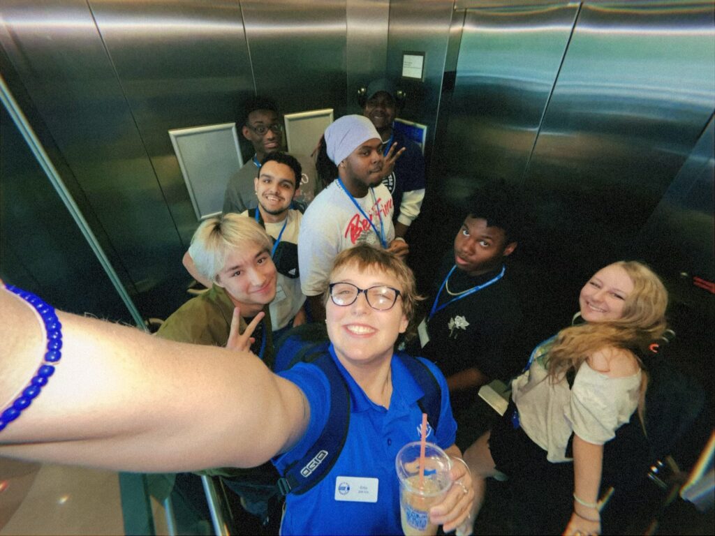 Students attending New to Blue Orientation posing for a photo with their Student Orientation Assistant.