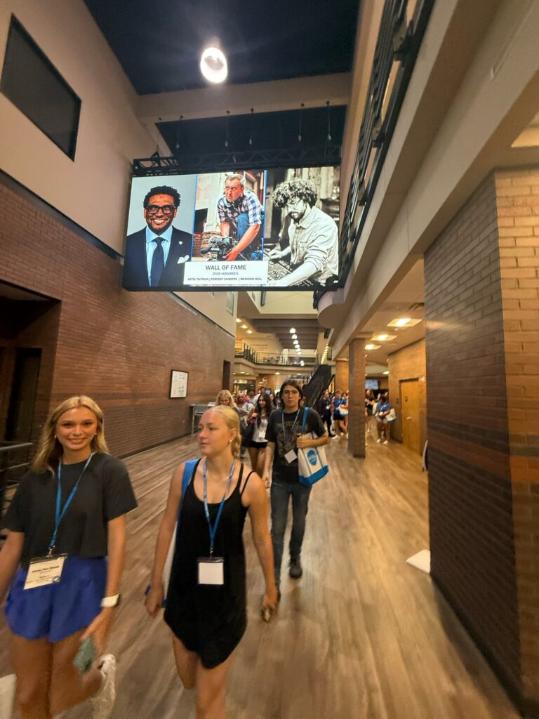 Students attending orientation walking through the BRAGG Building.