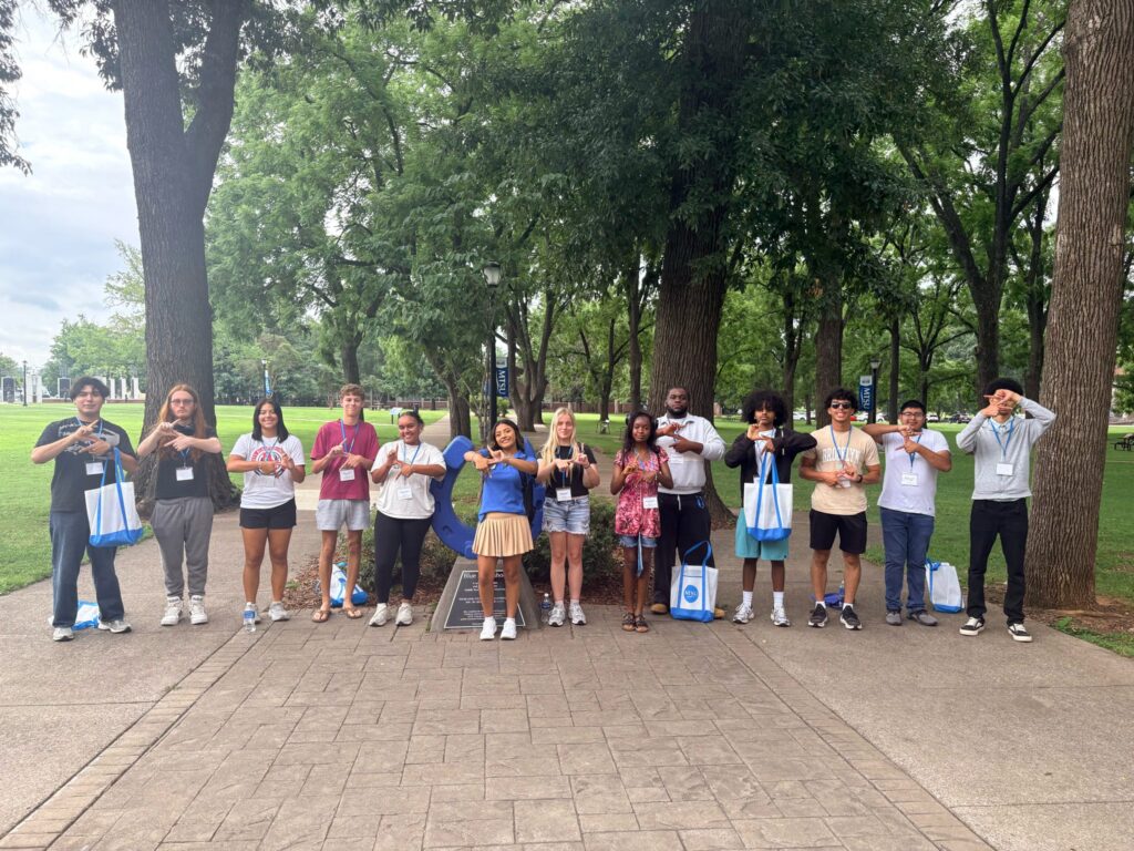 Students attending New to Blue Orientation posing for a photo with their Student Orientation Assistants.
