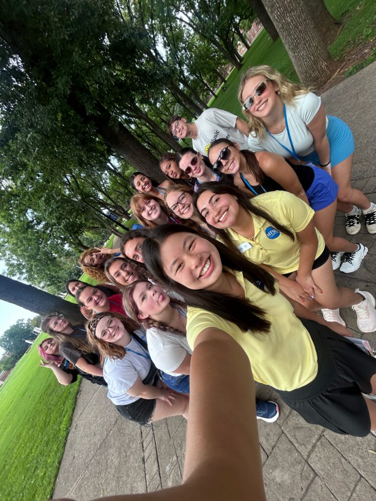 Students attending New to Blue Orientation posing for a photo with their Student Orientation Assistant.