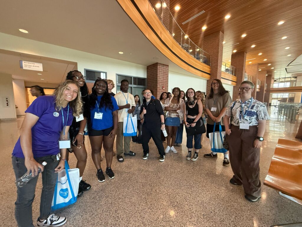 Students attending orientation standing inside the Student Union.