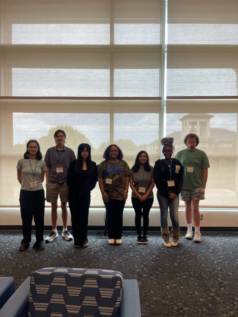 Students attending orientation standing inside the Student Union