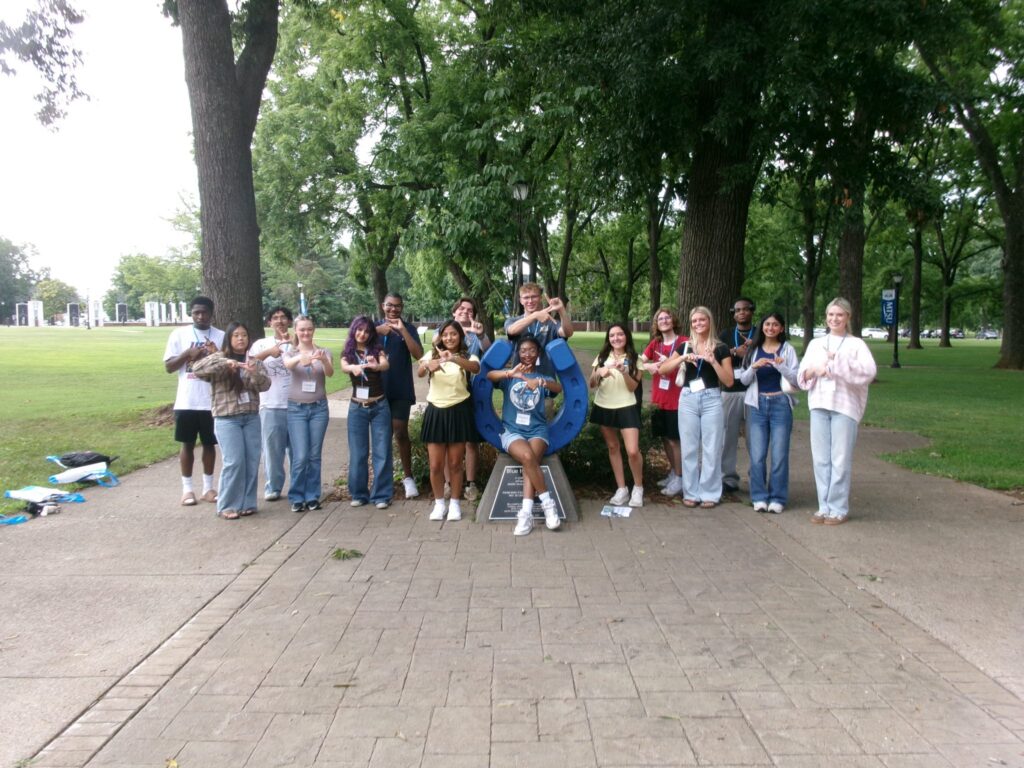 Students attending New to Blue Orientation posing for a photo with their Student Orientation Assistants.