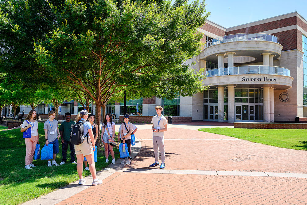 Student leading a tour on MTSU campus